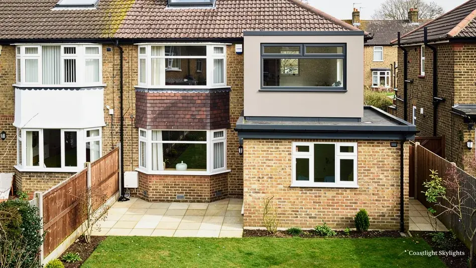 Rear of a semi-detached house with a loft dormer and a rear extension