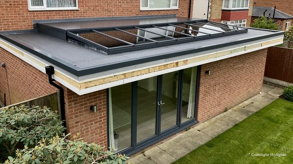 Brick extension with a flat roof, a rooflight and folding doors onto the garden