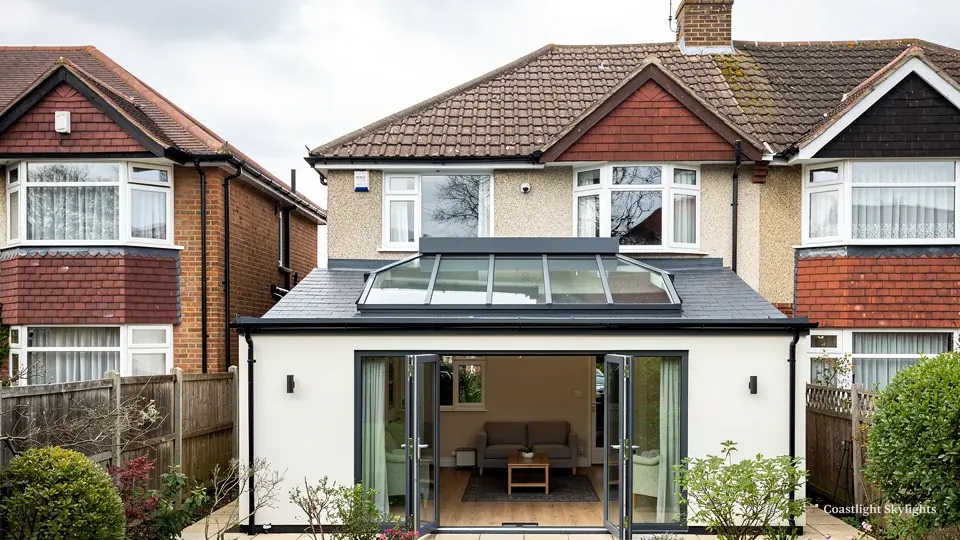 Rear of a semi-detached house with a glazed roof lantern over a kitchen extension
